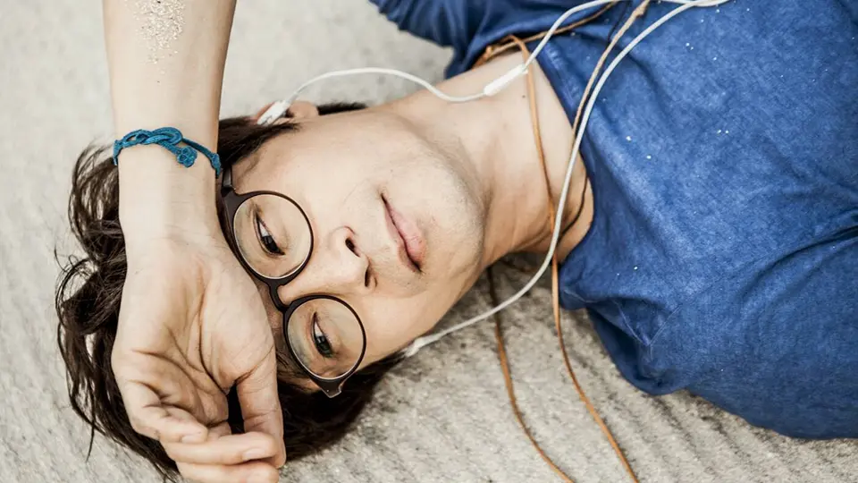Haki Park, a Korean folk singer listening to music